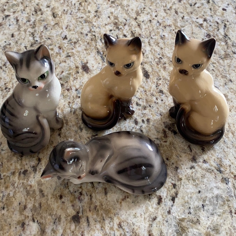 Set of four ceramic cat figurines